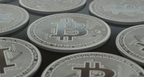 BNB coin resting on a circuit board surface