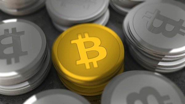 Ethereum and BNB coins placed together on a dark background