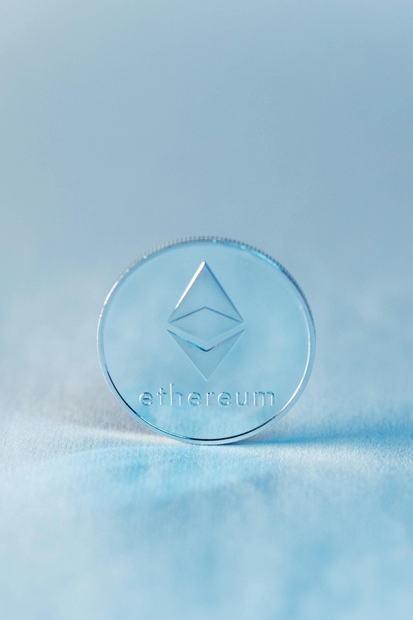 Ethereum and Solana coins side by side on a dark surface