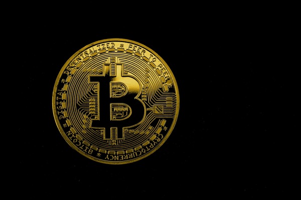 Ethereum and XRP coins arranged near a trading chart