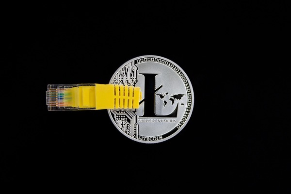 Ethereum wallet address displayed as a QR code and hexadecimal string on a screen