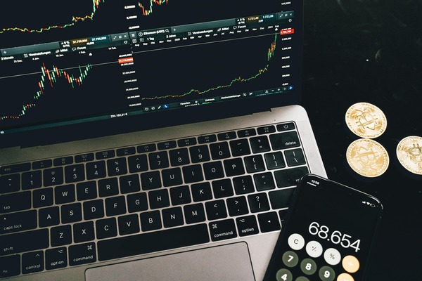 Trading screens showing live cryptocurrency market data