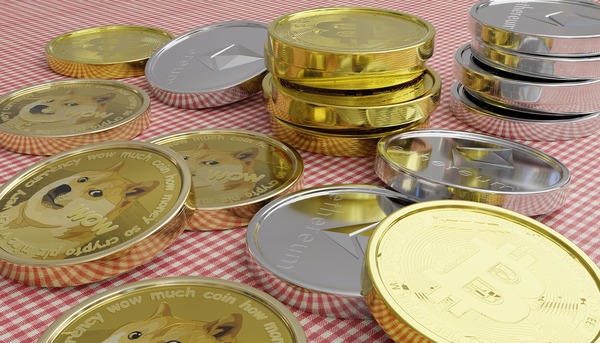 Tether USDT stablecoin token beside an Ethereum coin